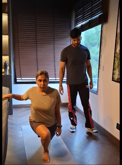 Personal trainer guiding a client